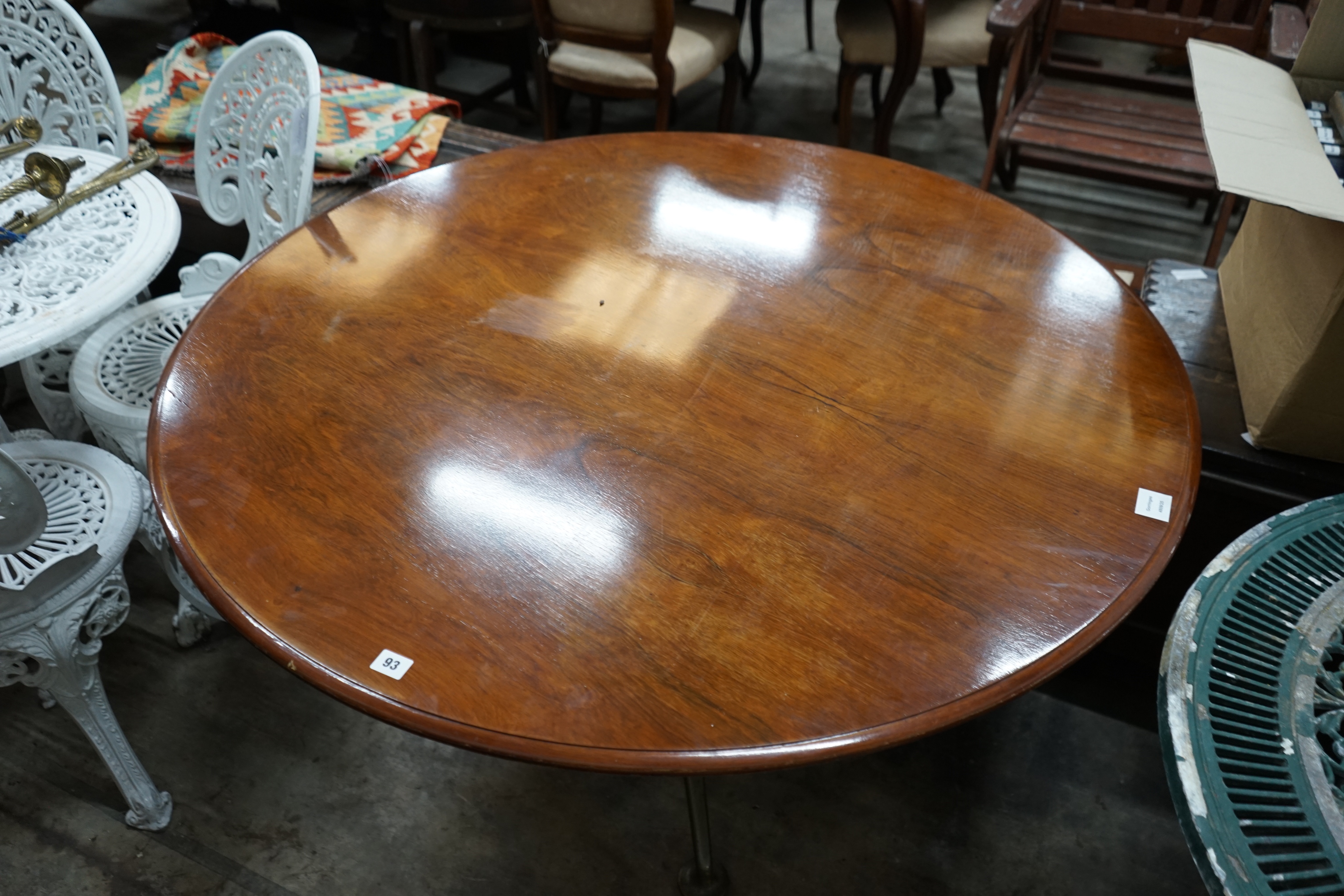 A mid century design circular centre table, on spoked metal base, width 122cm height 67cm